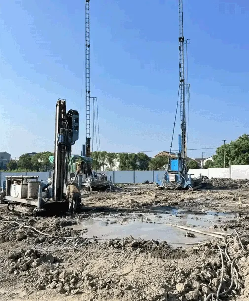 Track-mounted drilling rig performing ground improvement on site