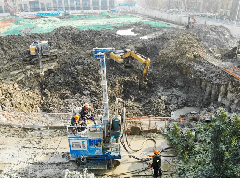 Ammann SJL-120 jet grouting drill working at foundation pit site