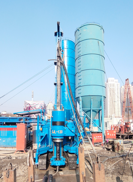 SJL-120 jet grouting drill and cement silo at construction site