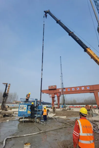 SJL-120 drill rig with crane lifting drill pipe at Jiaozuo site