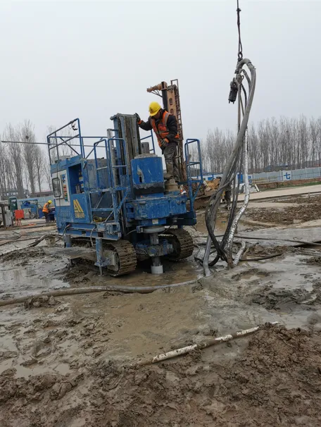 Workers operating SJL-120 rotary jet drill at construction site